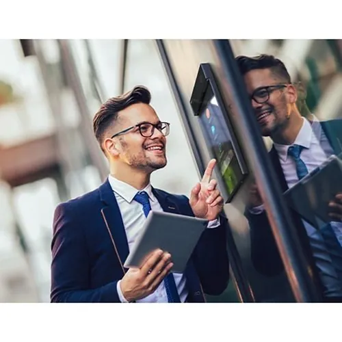 Visitor using a 2N video intercom at a commercial door